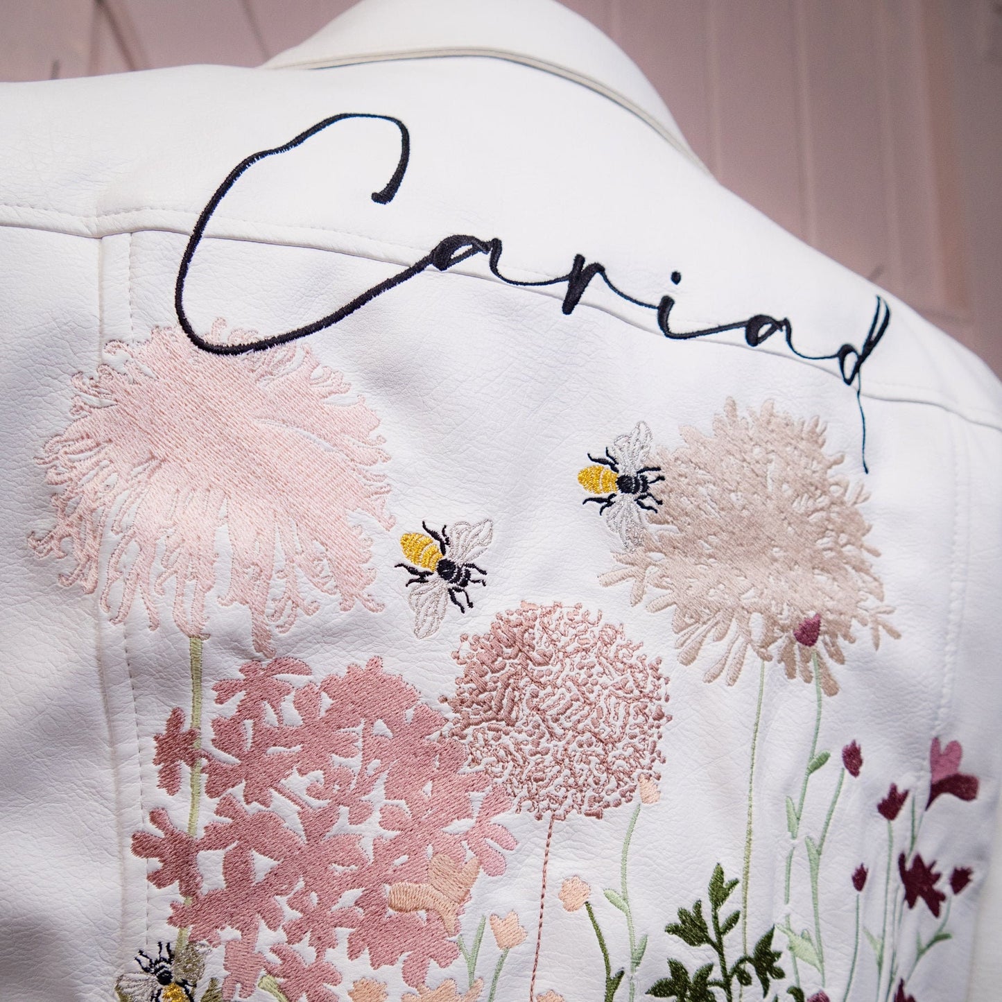 Wildflowers in Ecru: Enhance your wedding style with this charming embroidered jacket, a perfect blend of boho-chic and bridal sophistication